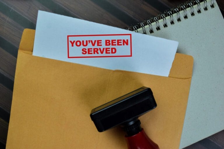 picture of a an envolope with you have been served written on it